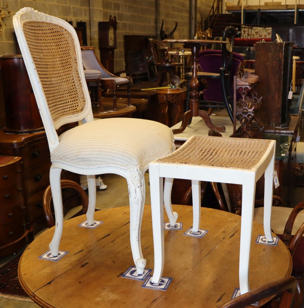 A Louis XVI style painted cane back chair and a caned dressing stool